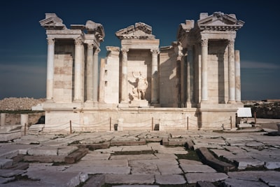 image: Ancient ruins of a temple stand tall.